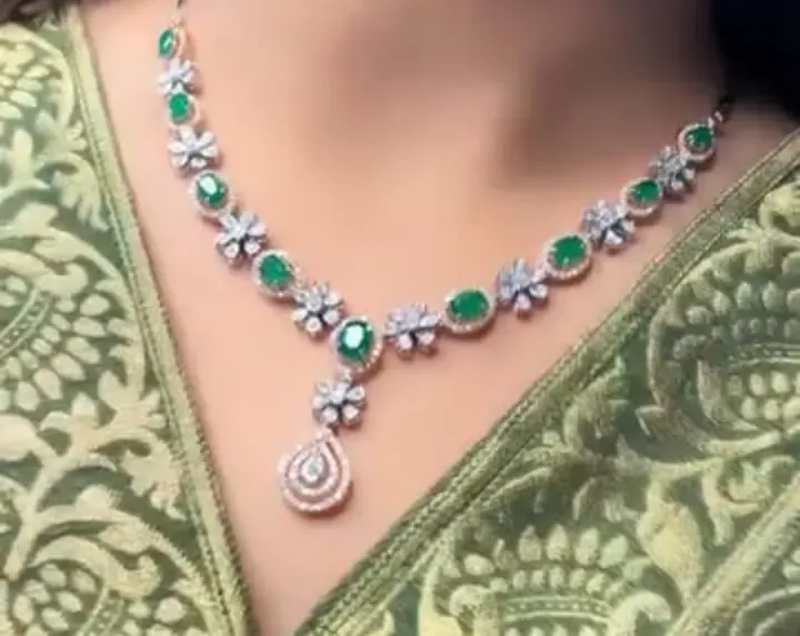 The Diya Emerald Floral Necklace — Oval emerald halos alternating with diamond blooms by Chawla Jewellers